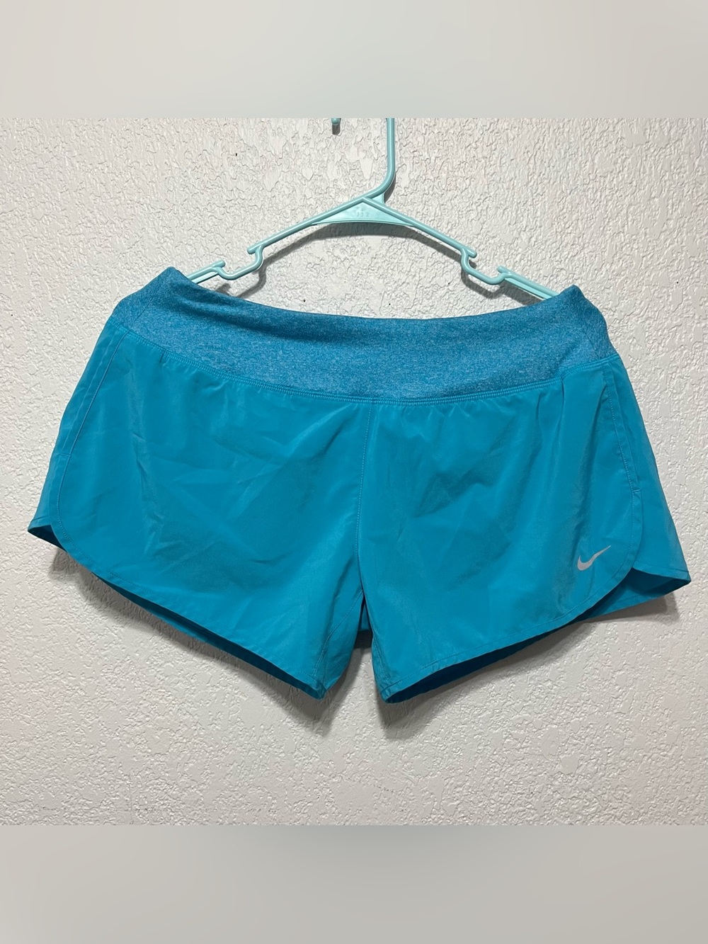 Nike Rival Women's 3-Inch Running Shorts in a vibrant teal/blue color size M